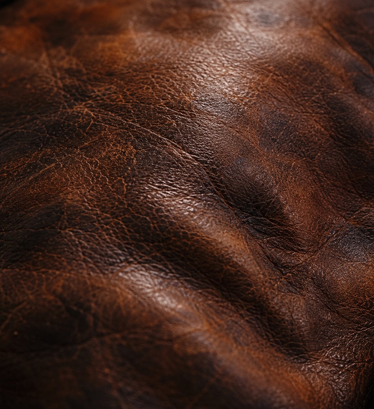 Aged leather surface with rich patina and wear
