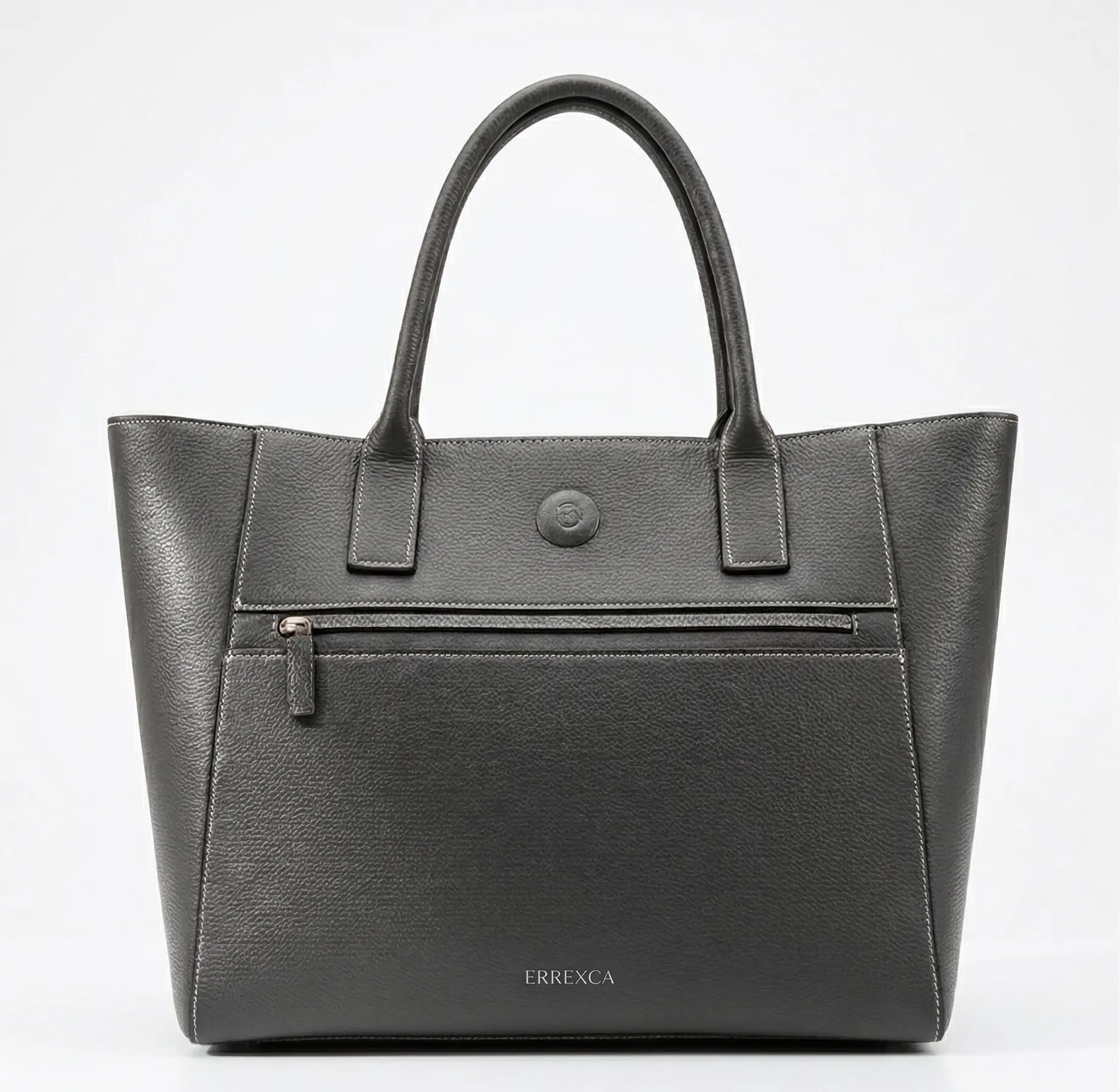 The Sculpted Portfolio - Premium large black leather tote bag resting on a minimalist concrete pedestal
